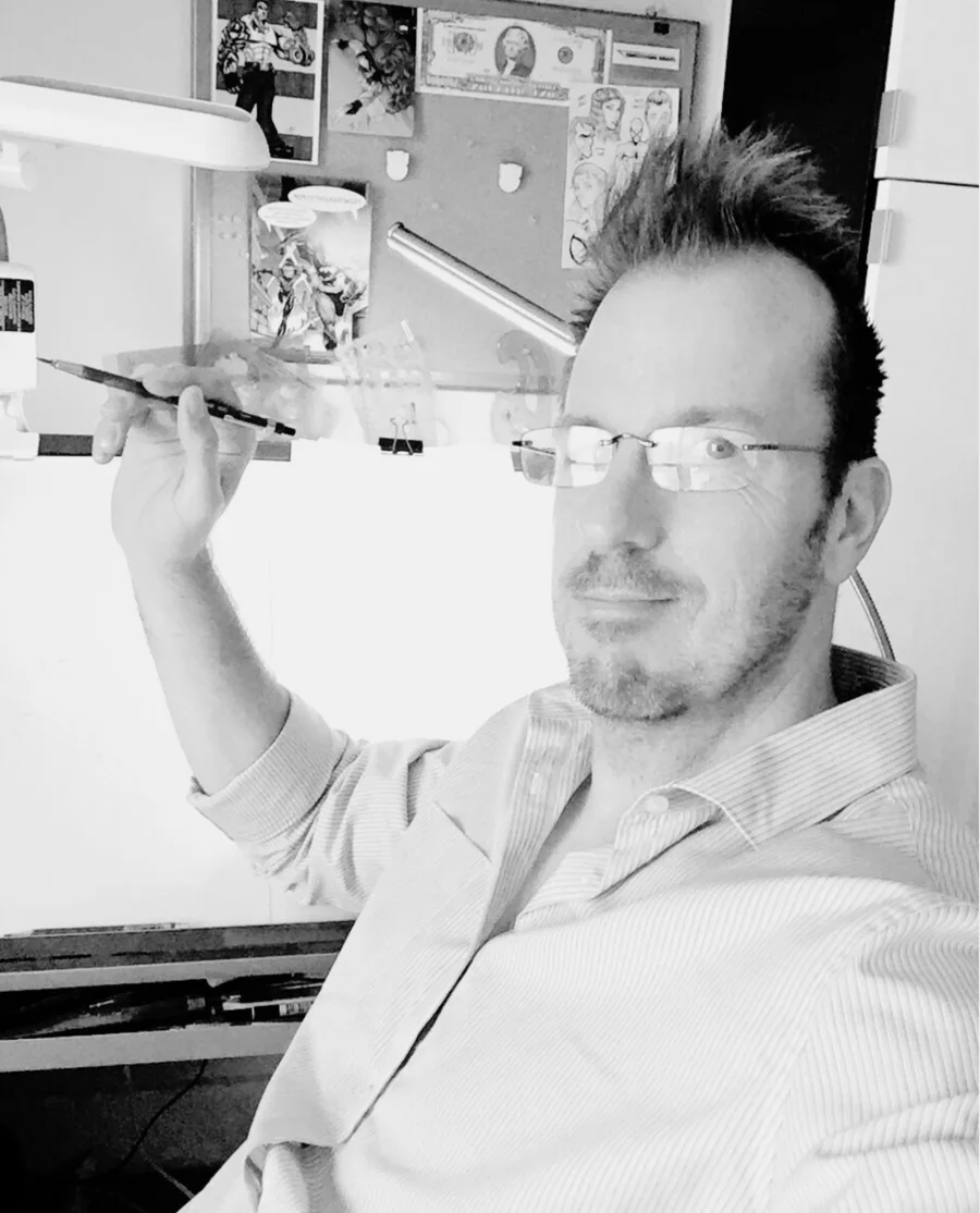 Mike Van Orden years ago at his drawing desk, pencil in hand
